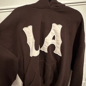 Brown Hoodie with White Lettering